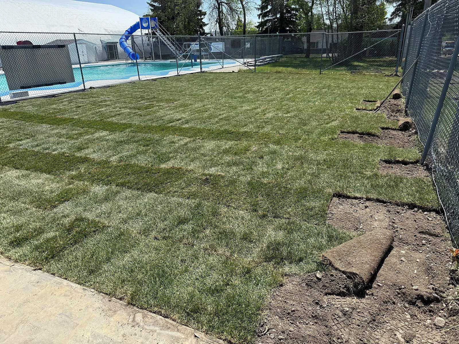 Freshly laid sod across the outdoor recreation area