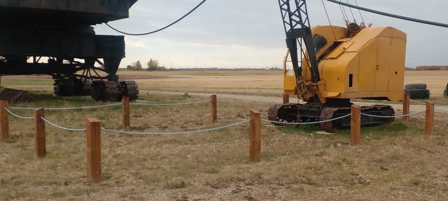 Timber posts and chain defining an outdoor display area