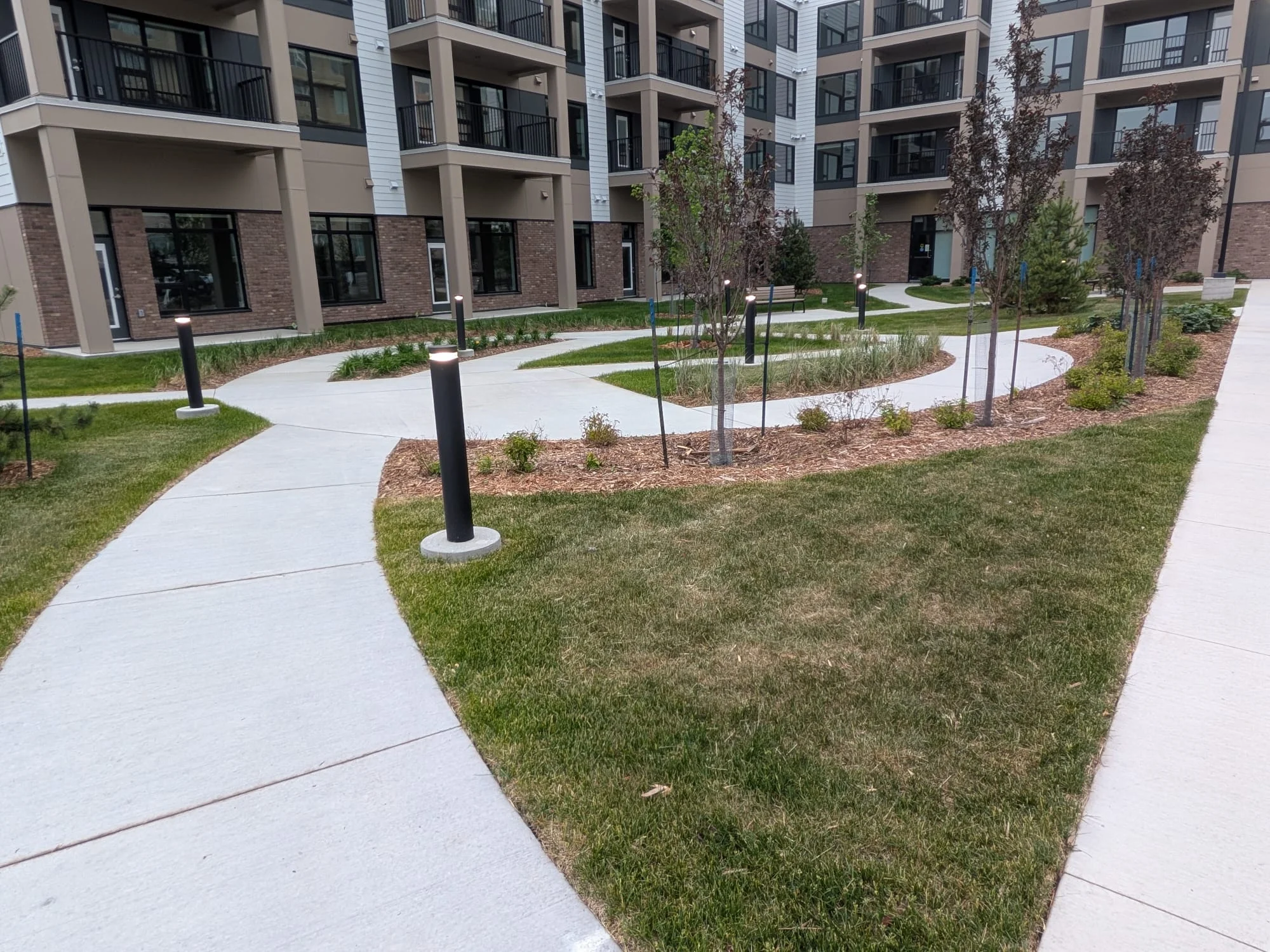 Curved walkways through planted gardens