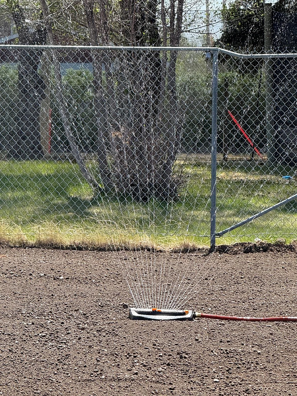 Close-up of sprinkler on a prepared soil surface
